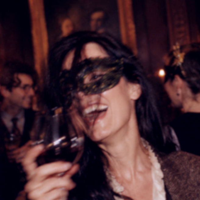 Sylvia Swan at a candlelit masked event